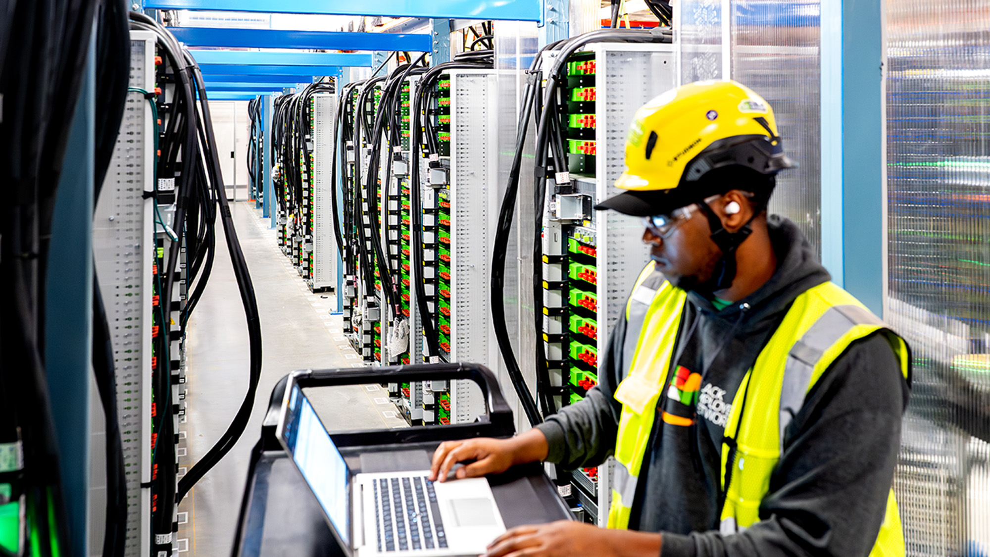 Technician checking data center